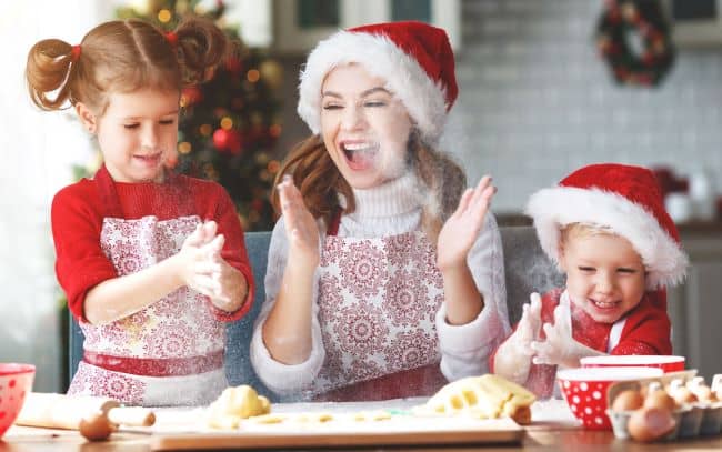 Happy family baking Christmas cookies.